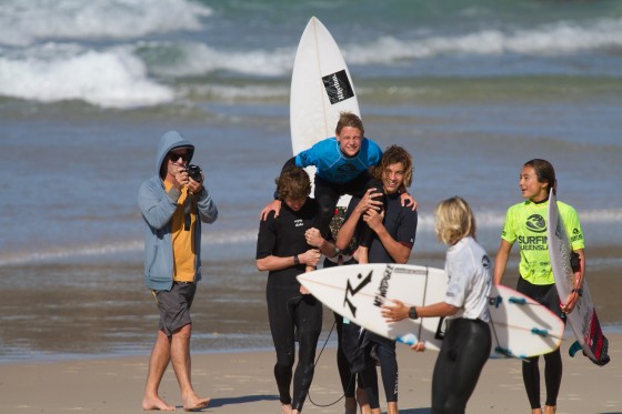 Maddy Job chaired up the beach by Toby and Liam after his win in the Under 16 final... Maddy is one of three groms off to the Australian Titles