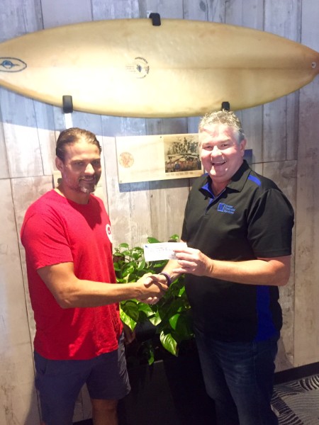 Ian Fraser from Fraser Financial Services hands over another cheque to Club President, James Lewis, in support of Burleigh Boardriders